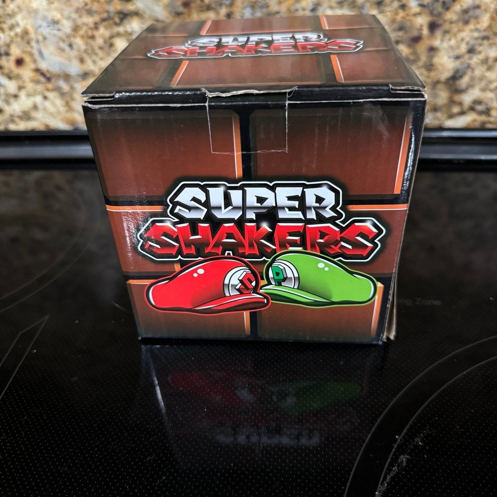 The Super Mario Bros. Salt & pepper shakers Mario & Luigi Hats set by Geek Fuel.